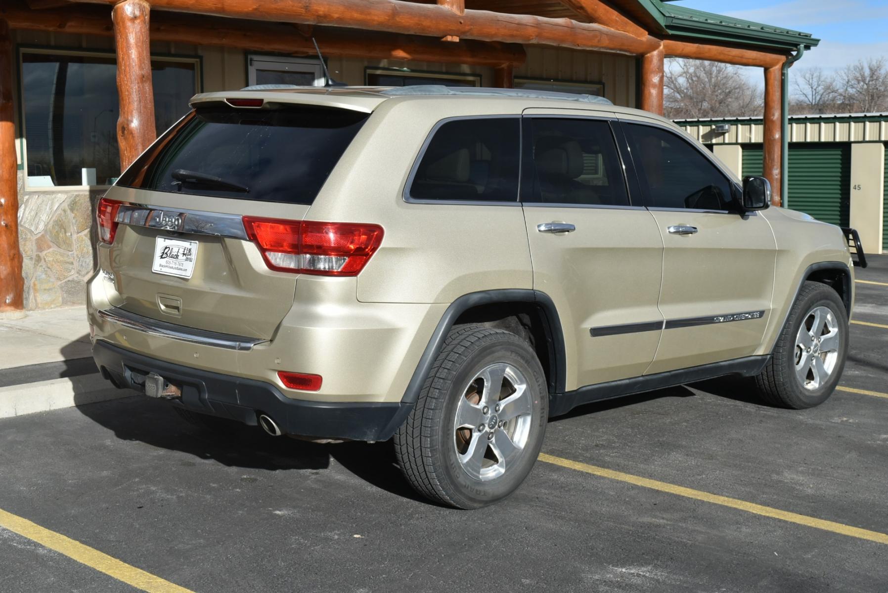 2011 Gold /Tan Jeep Grand Cherokee Limited (1J4RR5GT9BC) with an 5.7L HEMI V-8 engine, 5-Speed Automatic transmission, located at 1600 E Hwy 44, Rapid City, SD, 57703, (605) 716-7878, 44.070232, -103.171410 - Photo #7